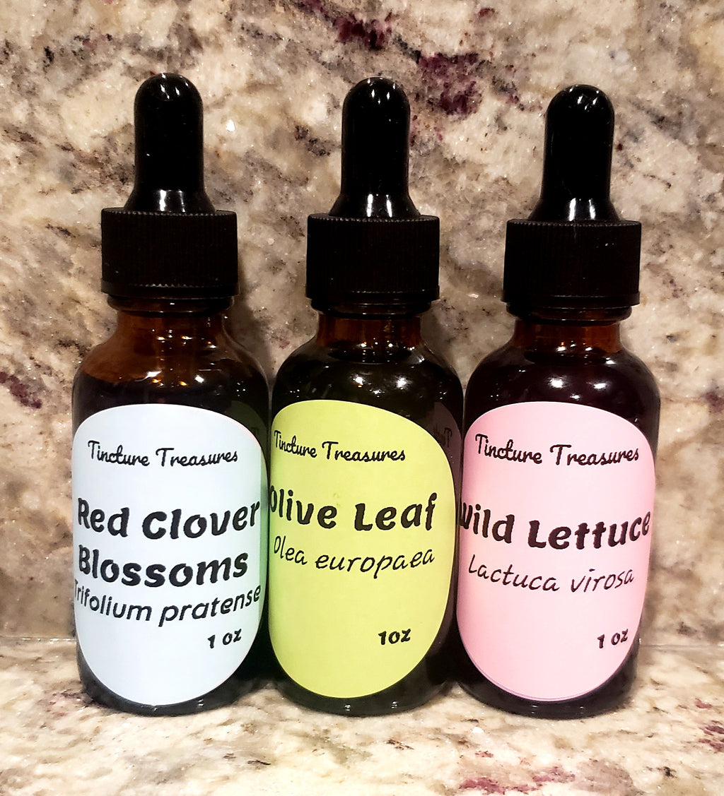 Assorted Tincture Sample Pack #3 with three 1 oz bottles from Tincture Treasures, displayed on a wooden surface.