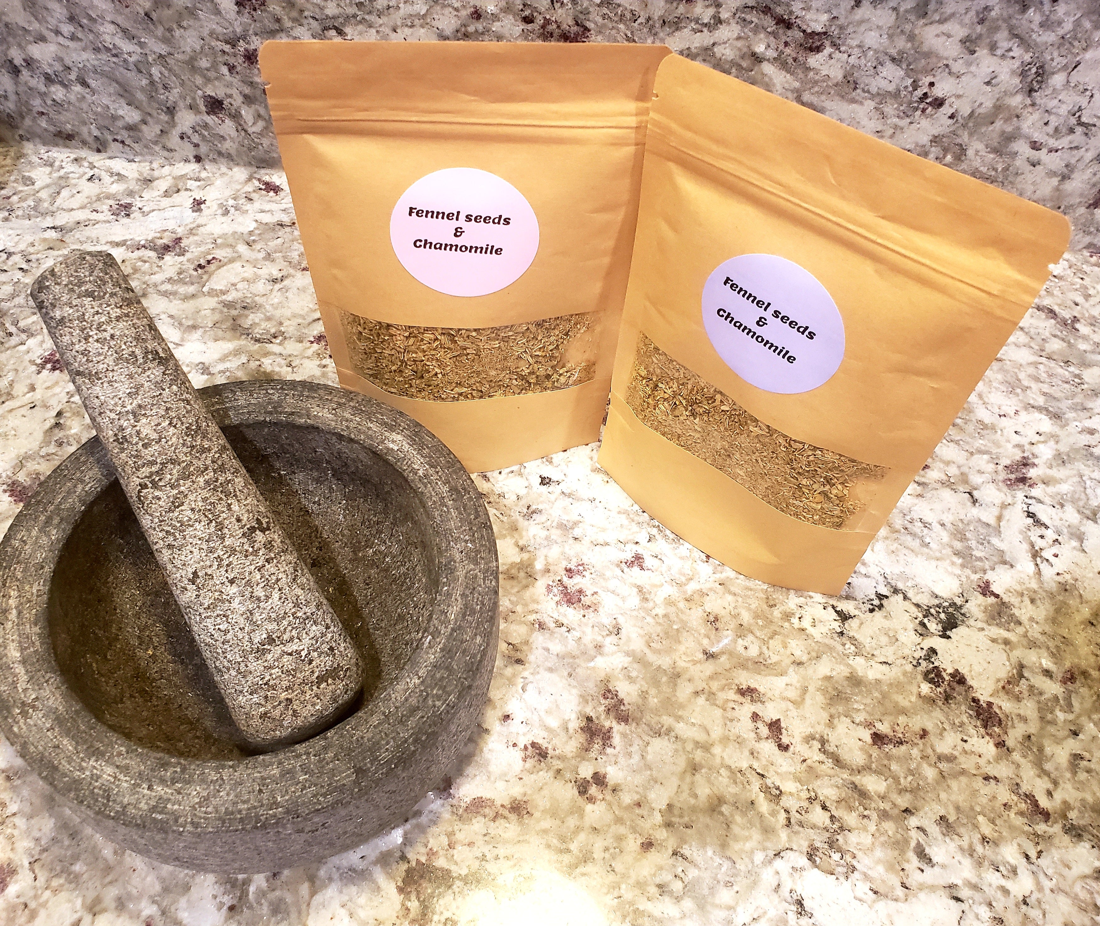 Herbal tea blend of organic fennel seed and chamomile loose tea by Tincture Treasures for digestive support, displayed in a tea cup.